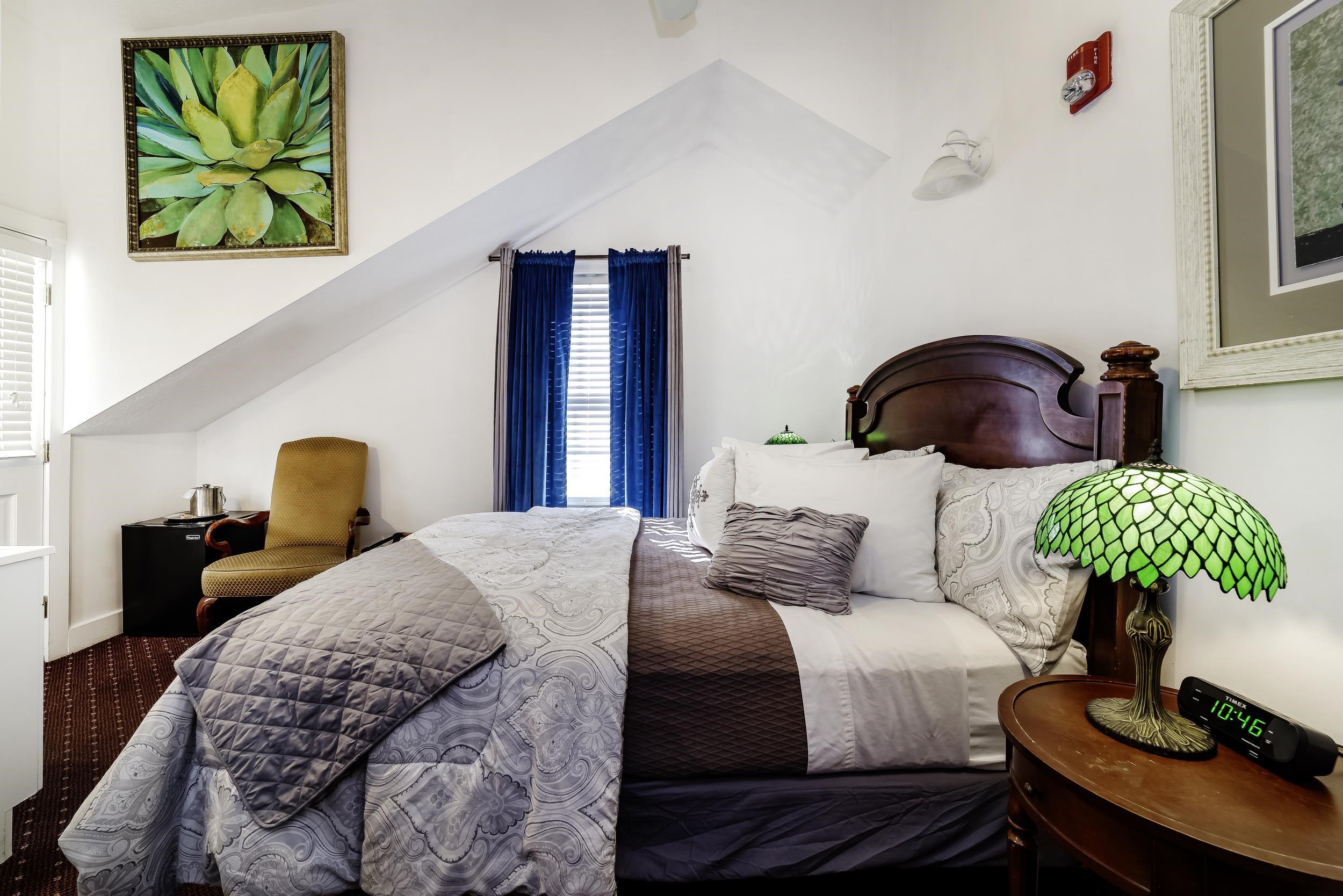 29 Cuna Street St. Augustine, FL 32084 - Photo 48 of 69 a bedroom with a bed and painting on the wall