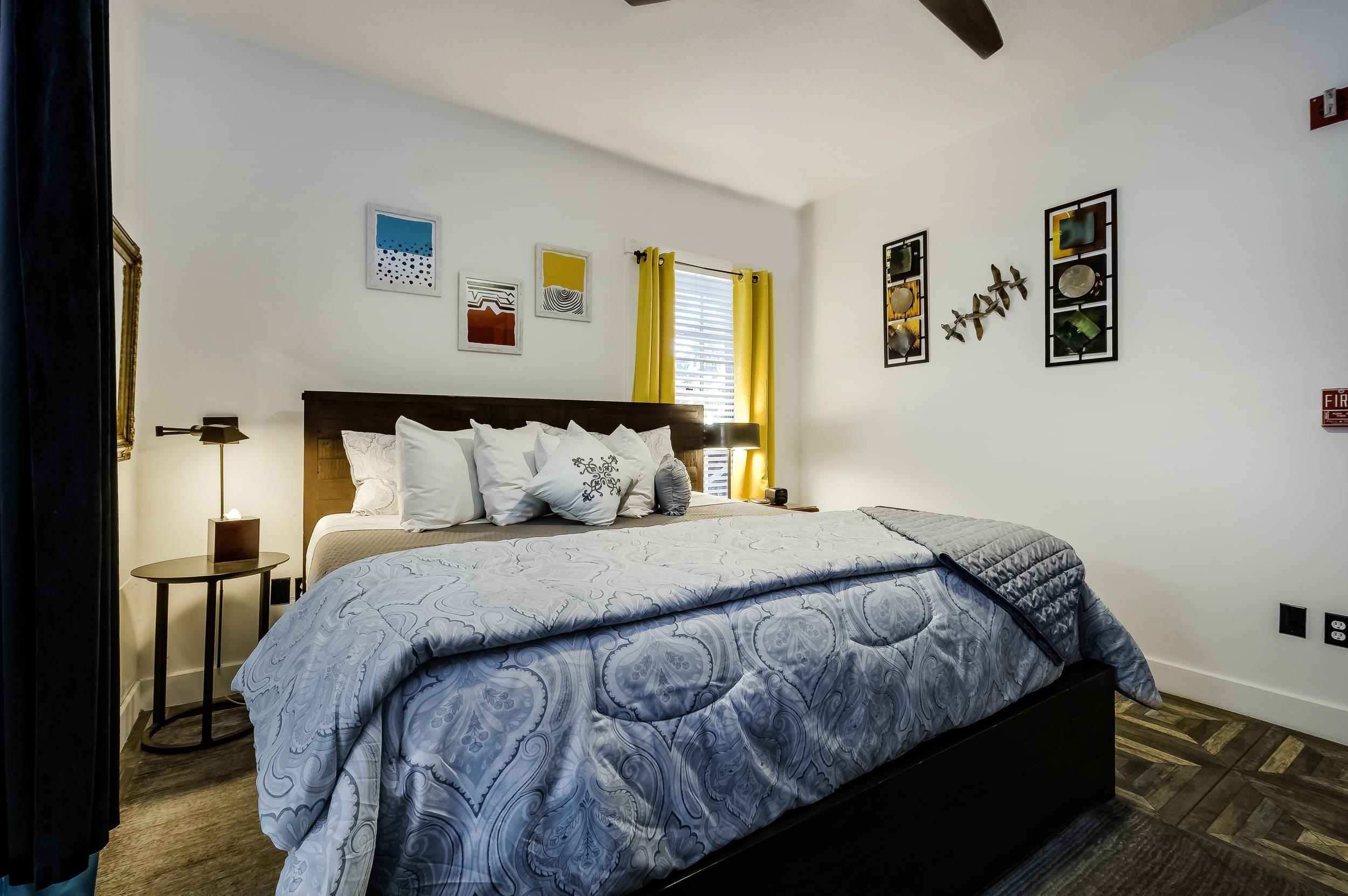 29 Cuna Street St. Augustine, FL 32084 - Photo 60 of 69 a bedroom with a bed and painting on the wall