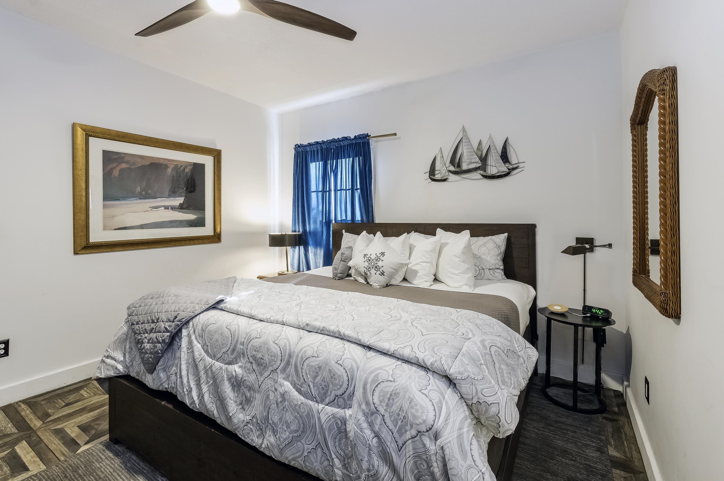 29 Cuna Street St. Augustine, FL 32084 - Photo 62 of 69 a bedroom with bed and a painting on the wall