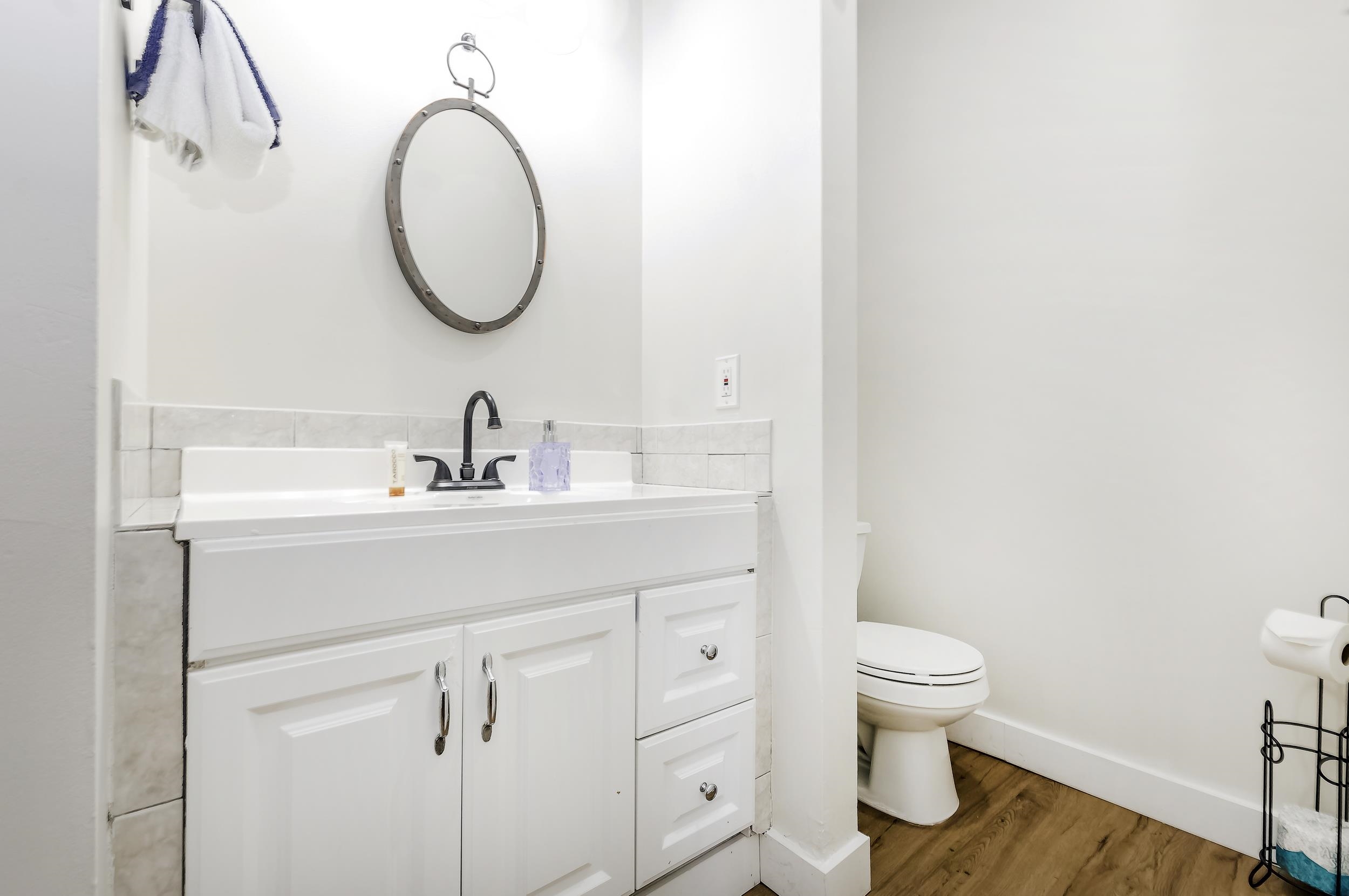29 Cuna Street St. Augustine, FL 32084 - Photo 67 of 69 a bathroom with a toilet sink and mirror