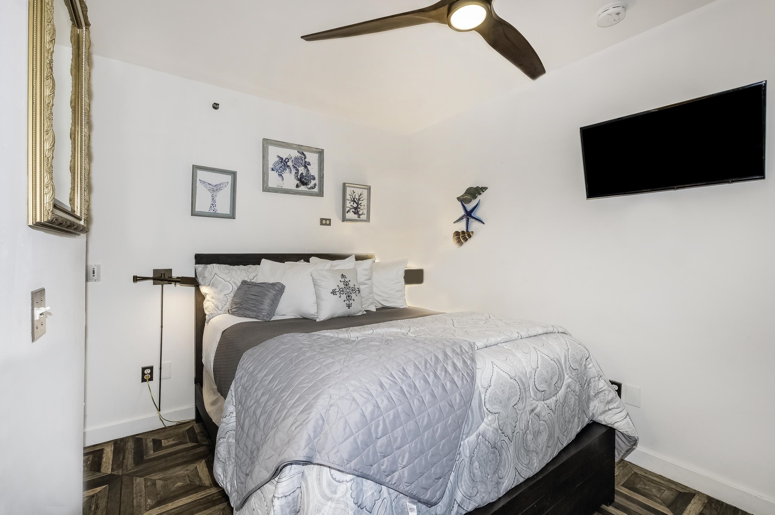 29 Cuna Street St. Augustine, FL 32084 - Photo 68 of 69 a bedroom with a bed and a flat screen tv