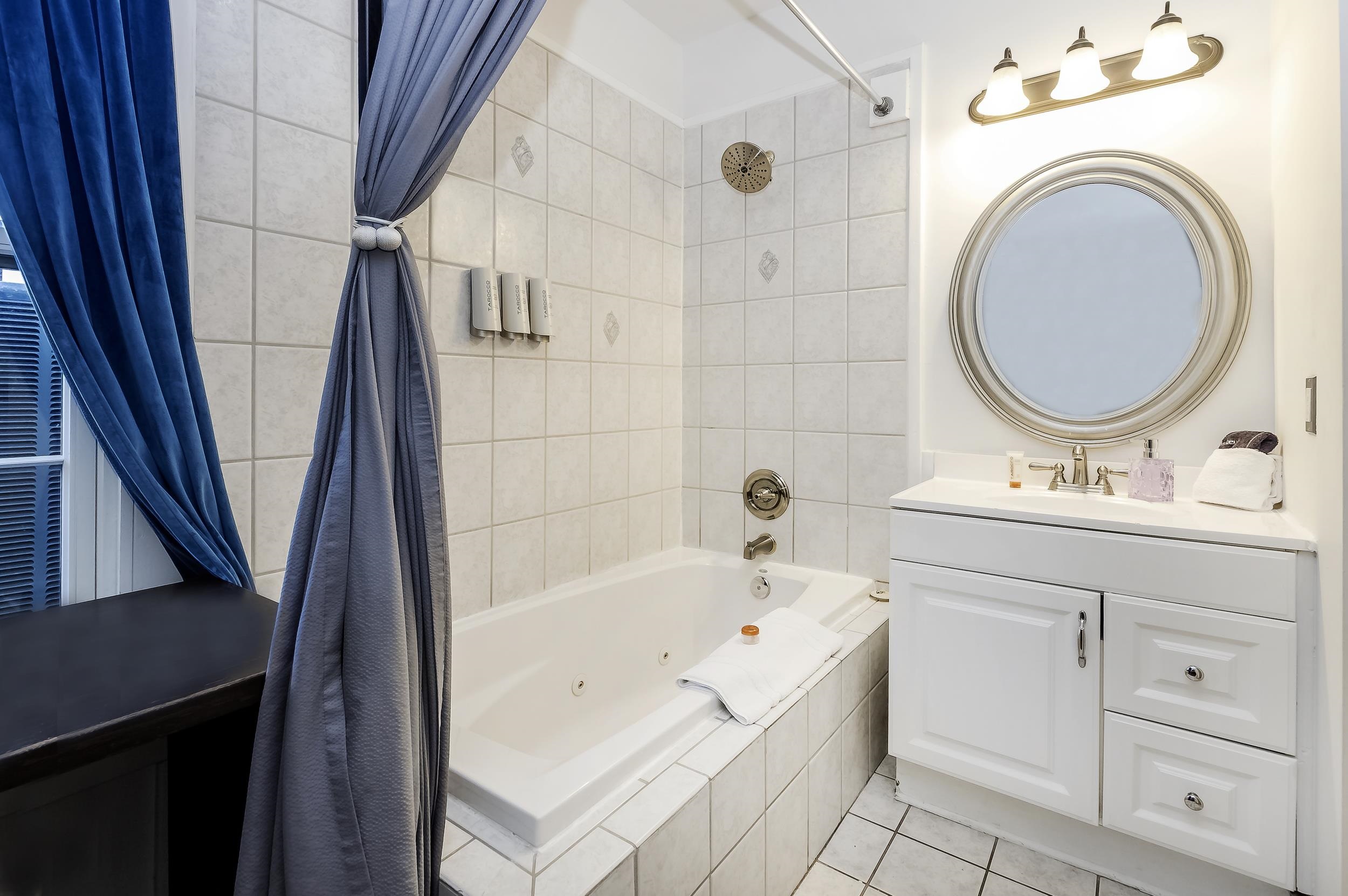 29 Cuna Street St. Augustine, FL 32084 - Photo 69 of 69 a bathroom with a sink a mirror and a bathtub