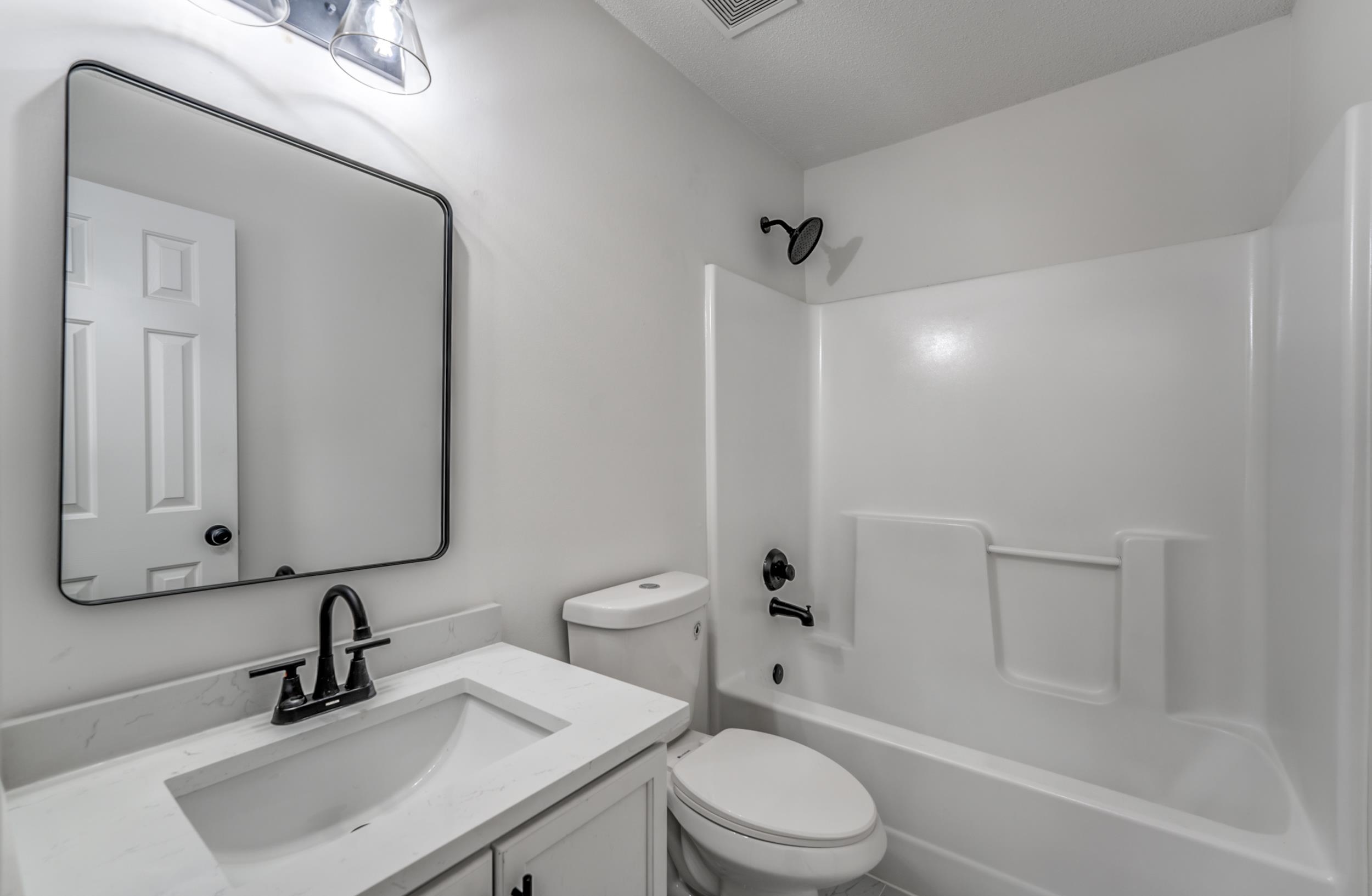 7880 Windy Willow Road Memphis, TN 38125 - Photo 17 of 37 Full bathroom featuring toilet, shower combination, and vanity