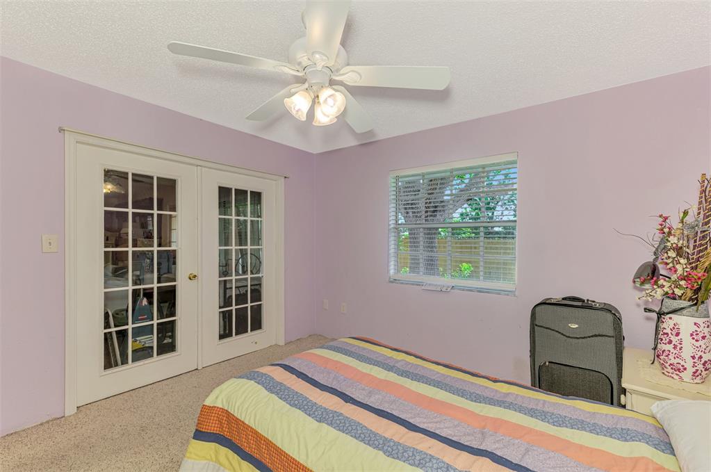 1137 Ponderosa Road Venice, FL 34293 - Photo 29 of 48 a bedroom with a bed and a window