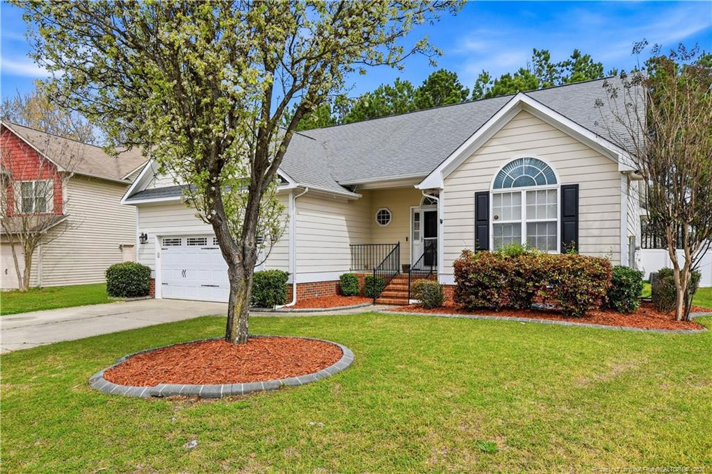 212 Lennox Loop Raeford, NC 28376 - Photo 42 of 47 a front view of a house with a yard