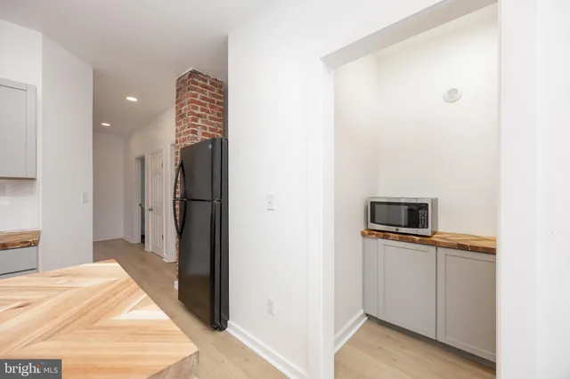 a kitchen with stainless steel appliances a refrigerator and a sink