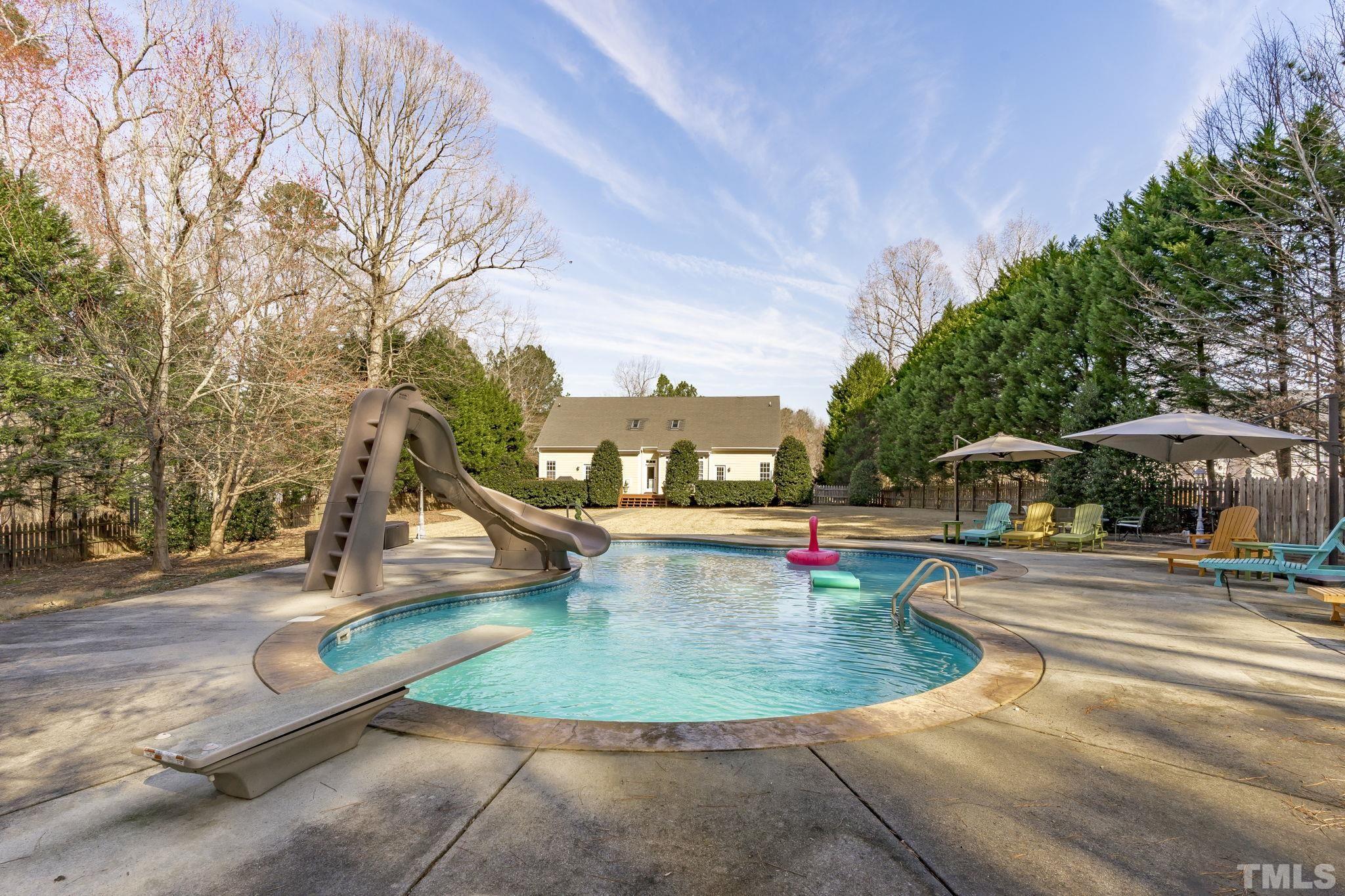 2904 Sunnystone Way Raleigh, NC 27613 - Photo 46 of 51 a view of a swimming pool with a yard