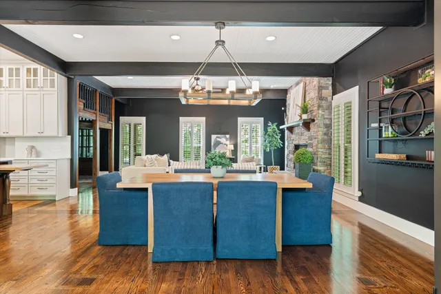 a view of a patio with table and chairs floor to ceiling window with wooden floor