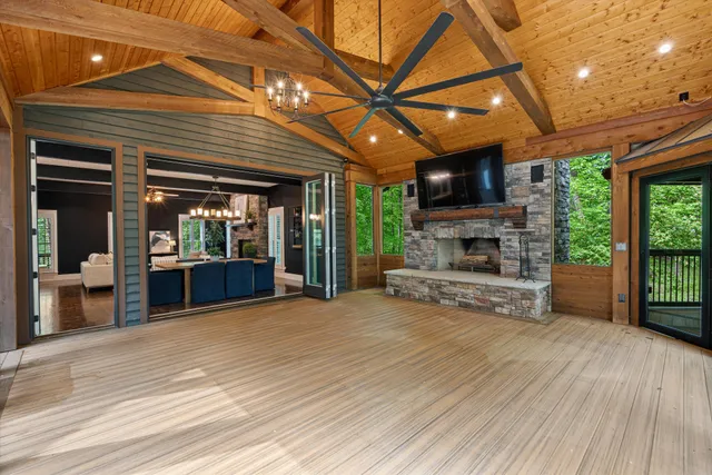 a kitchen with stainless steel appliances granite countertop a sink a stove and a refrigerator