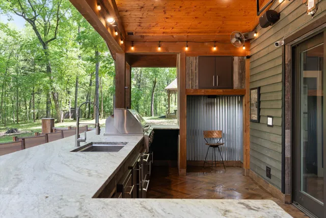 a bathroom with a double vanity sink toilet and shower