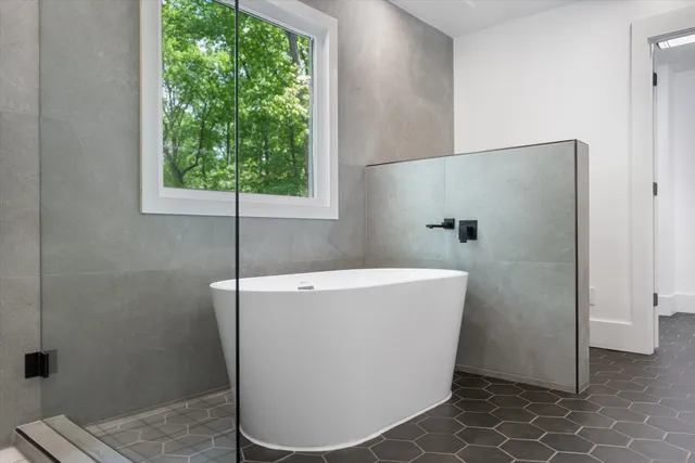 a view of a park with plants and large trees