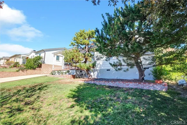 a view of yard with patio