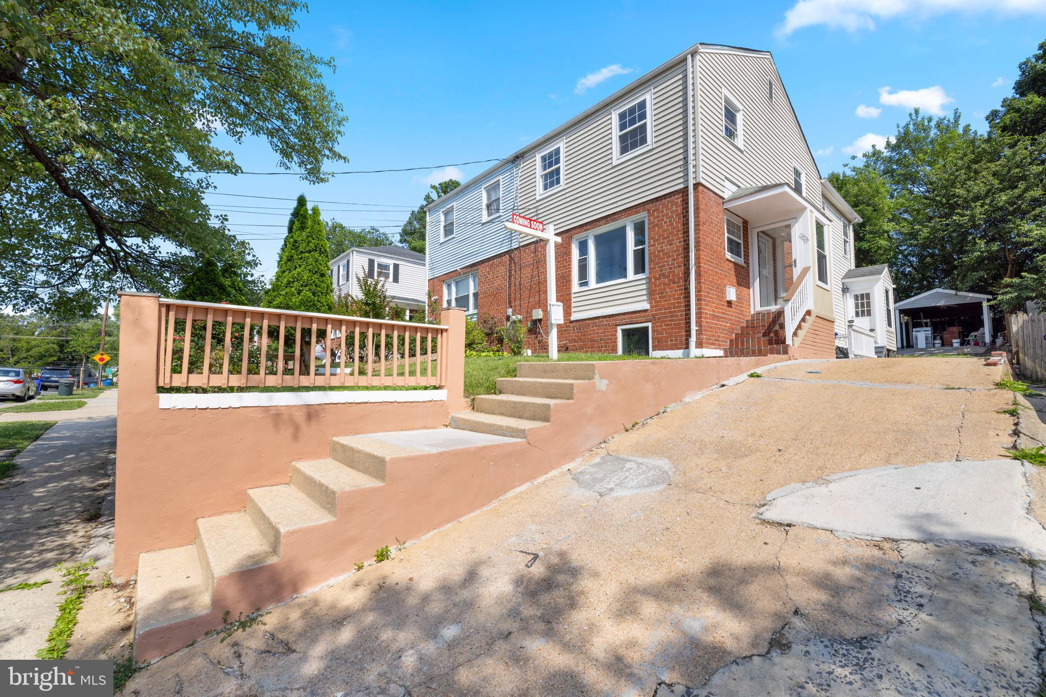 12025 Claridge Road Silver Spring, MD 20902 - Photo 2 of 25 a front view of a building with a yard