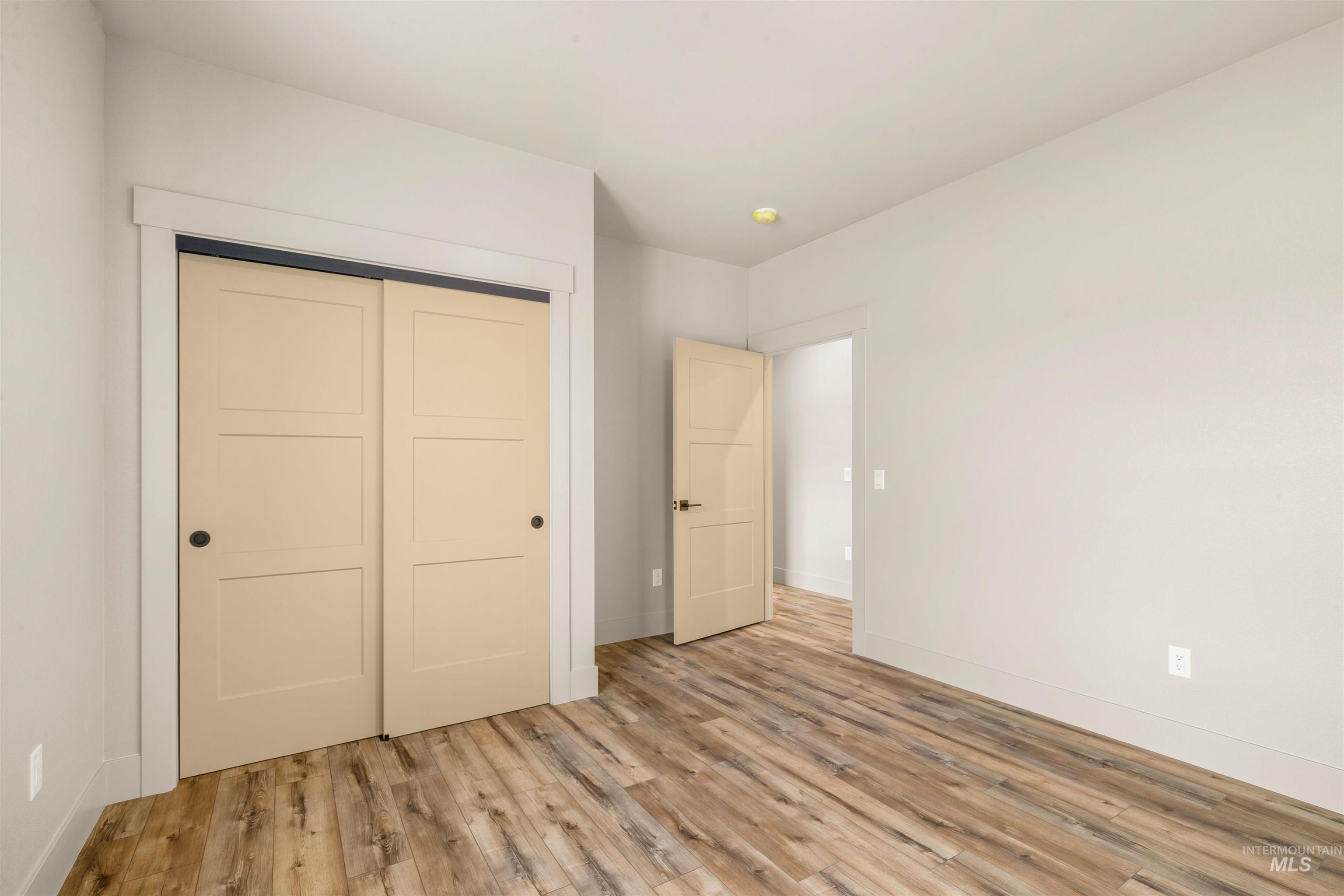 335 Warner Avenue Lewiston, ID 83501 - Photo 32 of 43 Unfurnished bedroom with a closet and light wood-style flooring