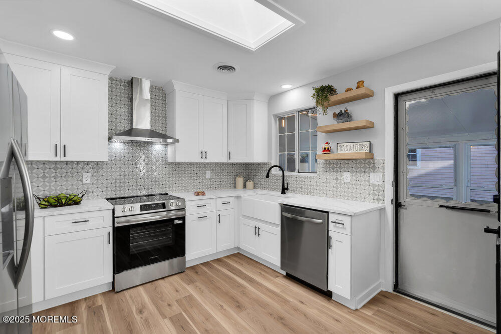 6 Berkeley Street, Unit 64 Whiting, NJ 08759 - Photo 11 of 31 a kitchen with stainless steel appliances granite countertop a stove and white cabinets