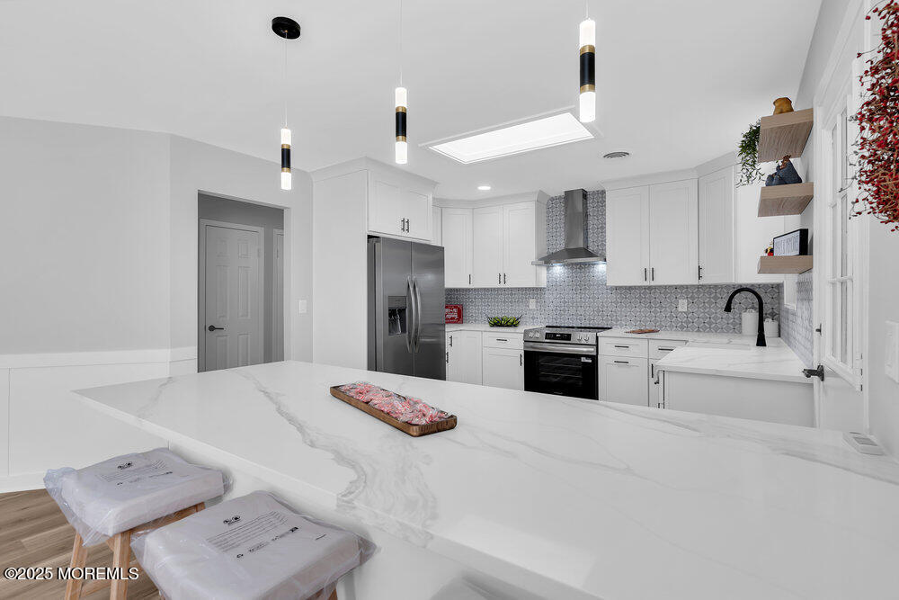 6 Berkeley Street, Unit 64 Whiting, NJ 08759 - Photo 13 of 31 a kitchen with a refrigerator a sink and white cabinets