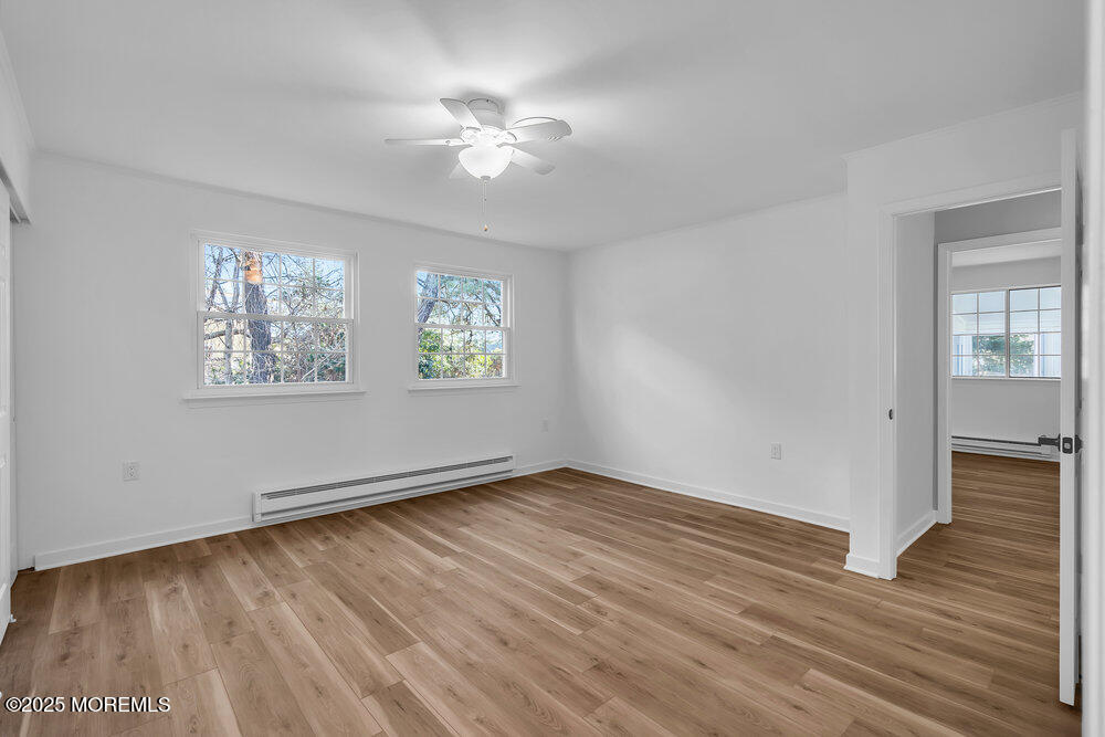 6 Berkeley Street, Unit 64 Whiting, NJ 08759 - Photo 15 of 31 a view of an empty room with wooden floor and a window