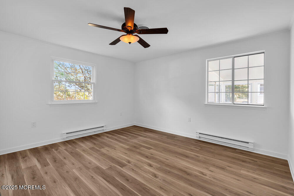 6 Berkeley Street, Unit 64 Whiting, NJ 08759 - Photo 24 of 31 a view of empty room with wooden floor and window
