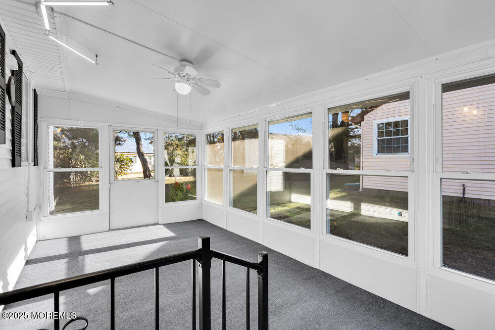 6 Berkeley Street, Unit 64 Whiting, NJ 08759 - Photo 27 of 31 a view of a large window with an outdoor space