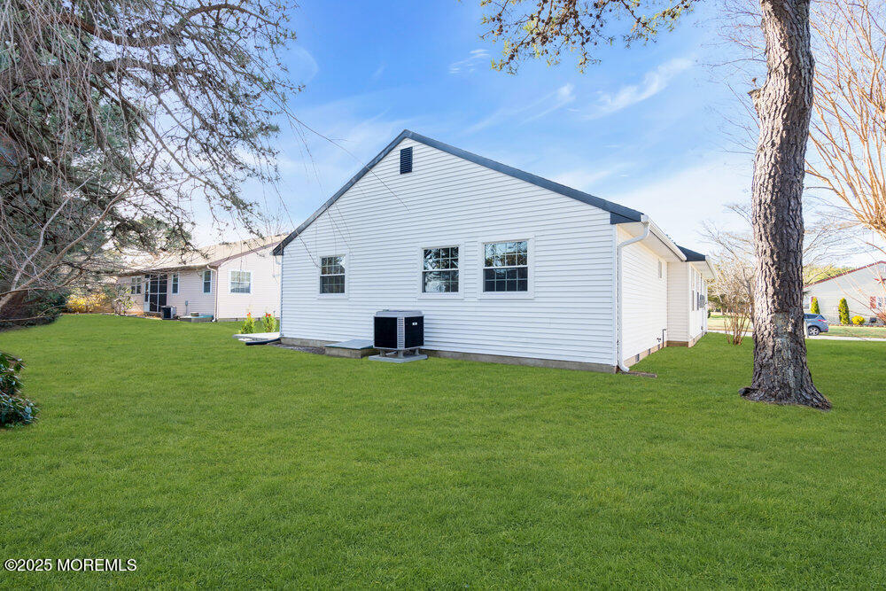 6 Berkeley Street, Unit 64 Whiting, NJ 08759 - Photo 29 of 31 a view of a backyard with a garden
