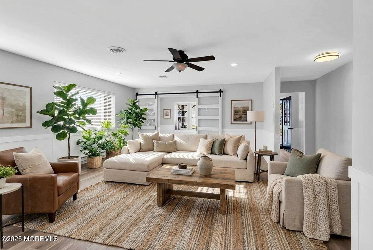 6 Berkeley Street, Unit 64 Whiting, NJ 08759 - Photo 5 of 31 a living room with furniture and a ceiling fan