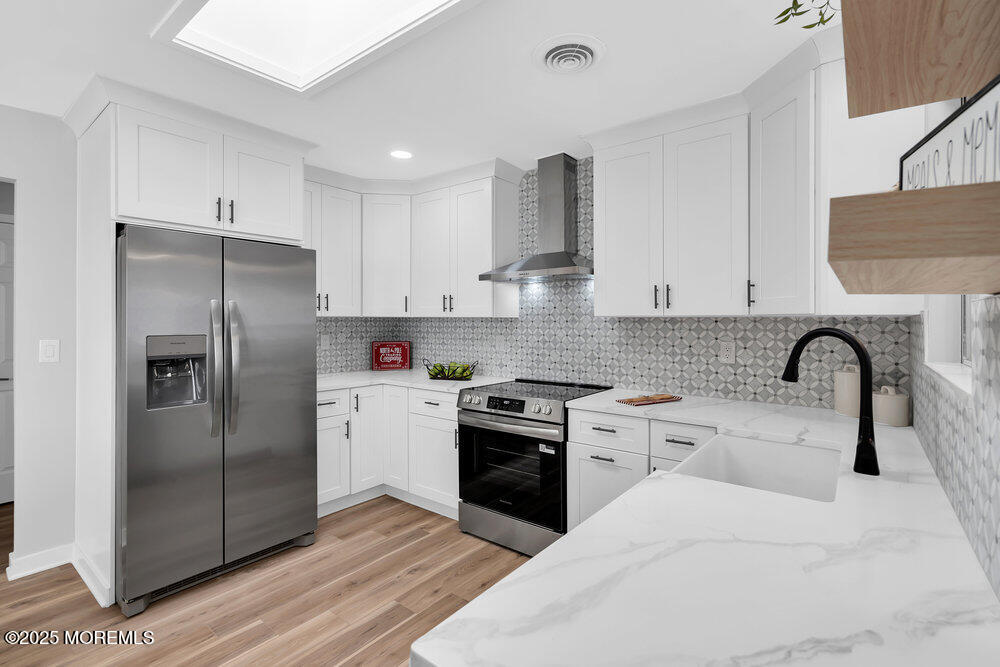 6 Berkeley Street, Unit 64 Whiting, NJ 08759 - Photo 10 of 31 a kitchen with stainless steel appliances granite countertop a refrigerator sink and stove