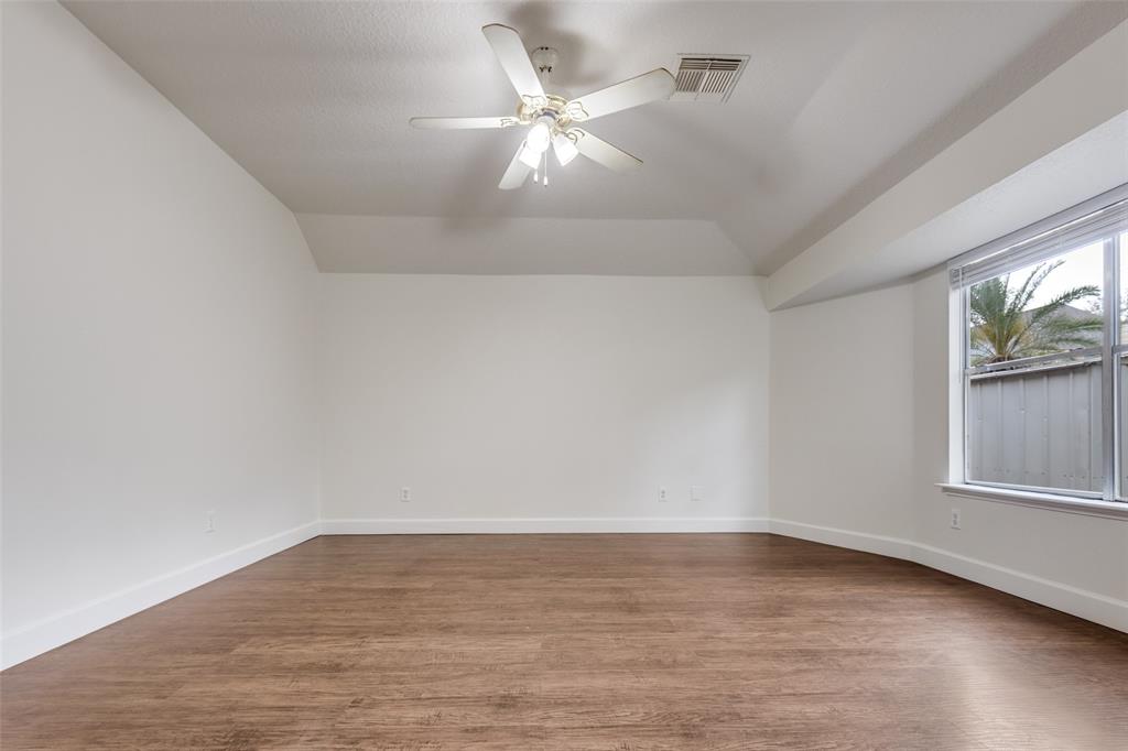 1314 Coppercrest Drive Spring, TX 77386 - Photo 11 of 22 wooden floor in an empty room with a window