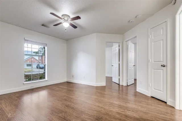 a bathroom with a toilet a sink a mirror and bathtub
