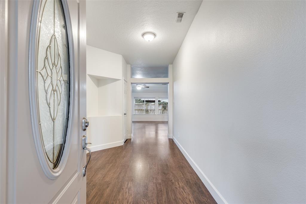1314 Coppercrest Drive Spring, TX 77386 - Photo 2 of 22 a view of a hallway with wooden floor