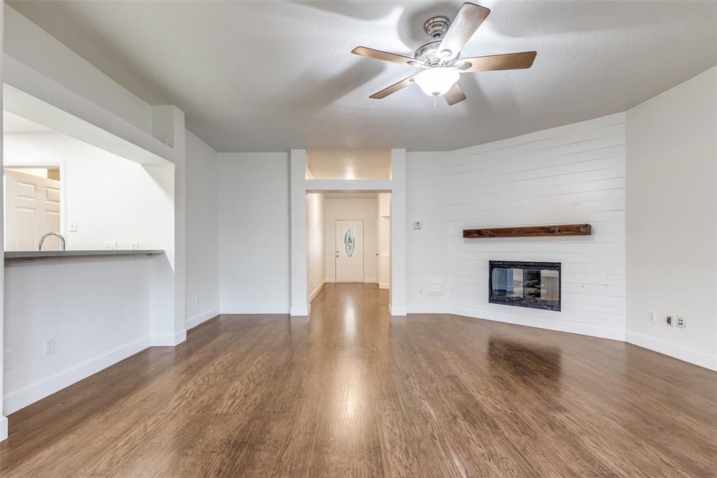 1314 Coppercrest Drive Spring, TX 77386 - Photo 5 of 22 a view of an empty room with a window and a fireplace