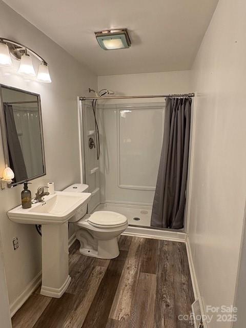 110 North Davis Street Dallas, NC 28034 - Photo 14 of 18 a bathroom with a sink toilet and shower