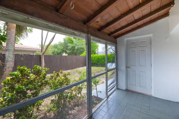 a view of a porch with a garden