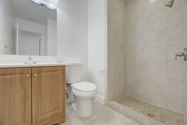 a bathroom with a sink toilet and vanity