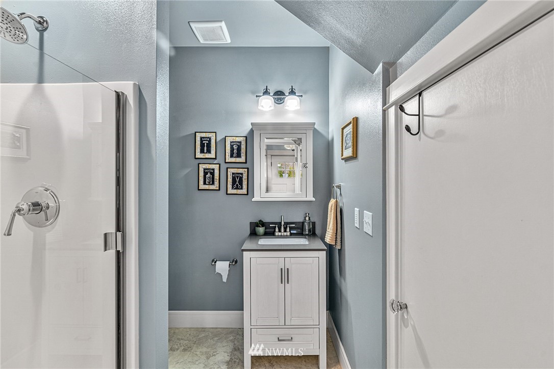 3020 Gedney Street Everett, WA 98201 - Photo 15 of 40 a bathroom with a sink and a mirror