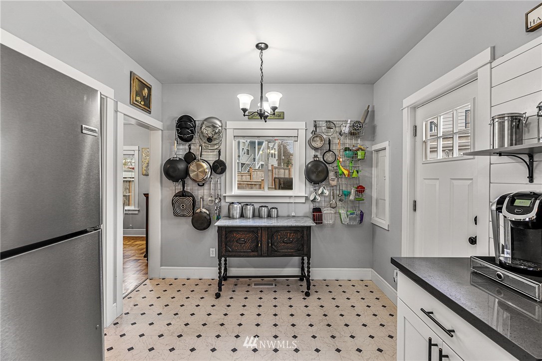 3020 Gedney Street Everett, WA 98201 - Photo 28 of 40 a living room with furniture a dining table and a chandelier