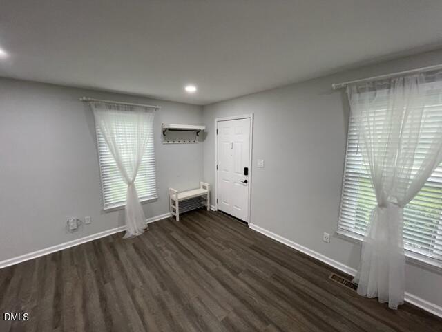 4804 Hoyle Drive, Unit A Raleigh, NC 27604 - Photo 5 of 19 wooden floor in an empty room with a window