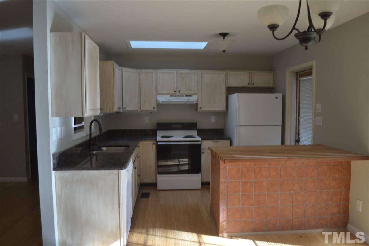 2704 Duke Homestead Road Durham, NC 27705 - Photo 6 of 25 Kitchen has an island. Seller has new appliances coming hope to be changing this photo soon.