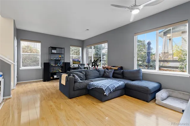 a living room with furniture and a large window