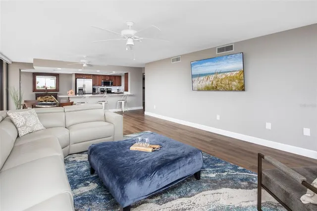 a living room with furniture and a rug