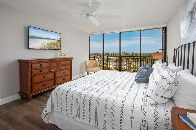 a bedroom with a large bed and a large window