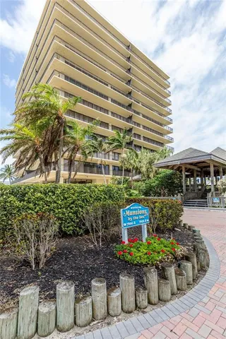 a front view of a building with garden