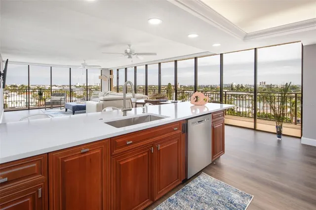 a open kitchen with a sink and large window