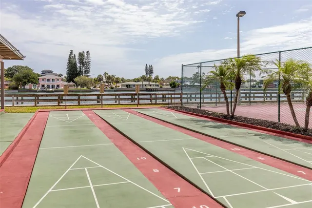 a view of a lake with couches in the background