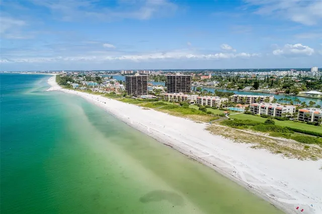a front view of a building with a garden