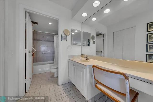 a view of a swimming pool with outdoor seating