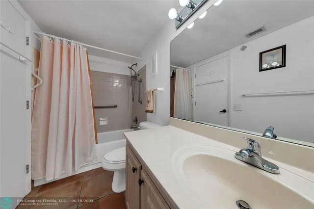 a row of palm trees and swimming pool in the backyard of a house