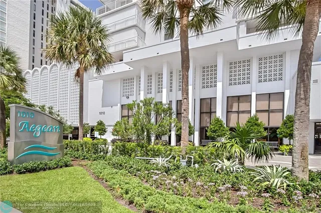 a kitchen with granite countertop a sink stove and cabinets