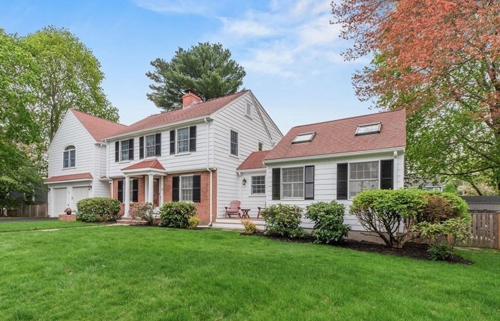 57 Douglas Road Needham, MA 02492 - Photo 2 of 22 a front view of a house with a yard and trees