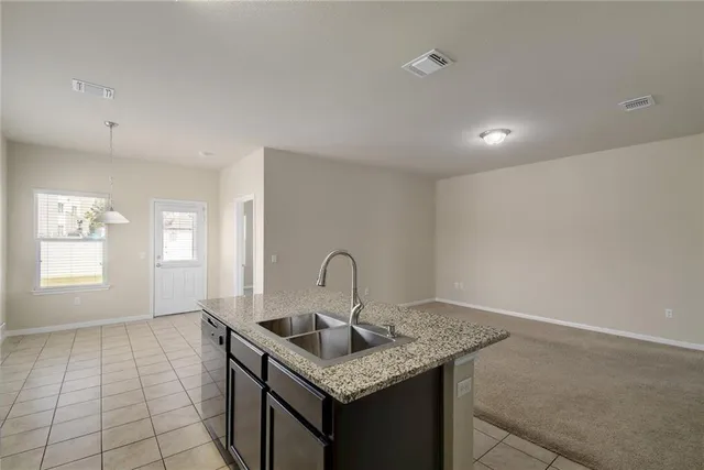 a kitchen with a sink and cabinets
