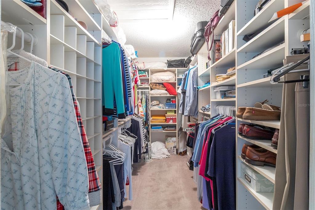 11634 Wheatfield Loop Hudson, FL 34667 - Photo 19 of 38 a view of walk in closet with clothes and shoes